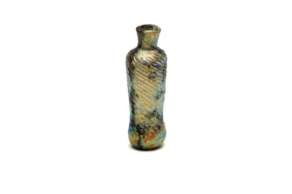 Lot 185: An Islamic Glass Bottle with Lovely Rainbow Patina...