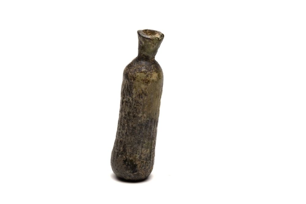 Lot 186: An Islamic Light Green Glass Bottle from the...