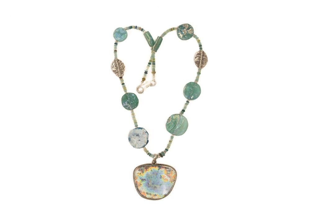 Lot 195: A Silver and Roman Glass Bead Necklace with...