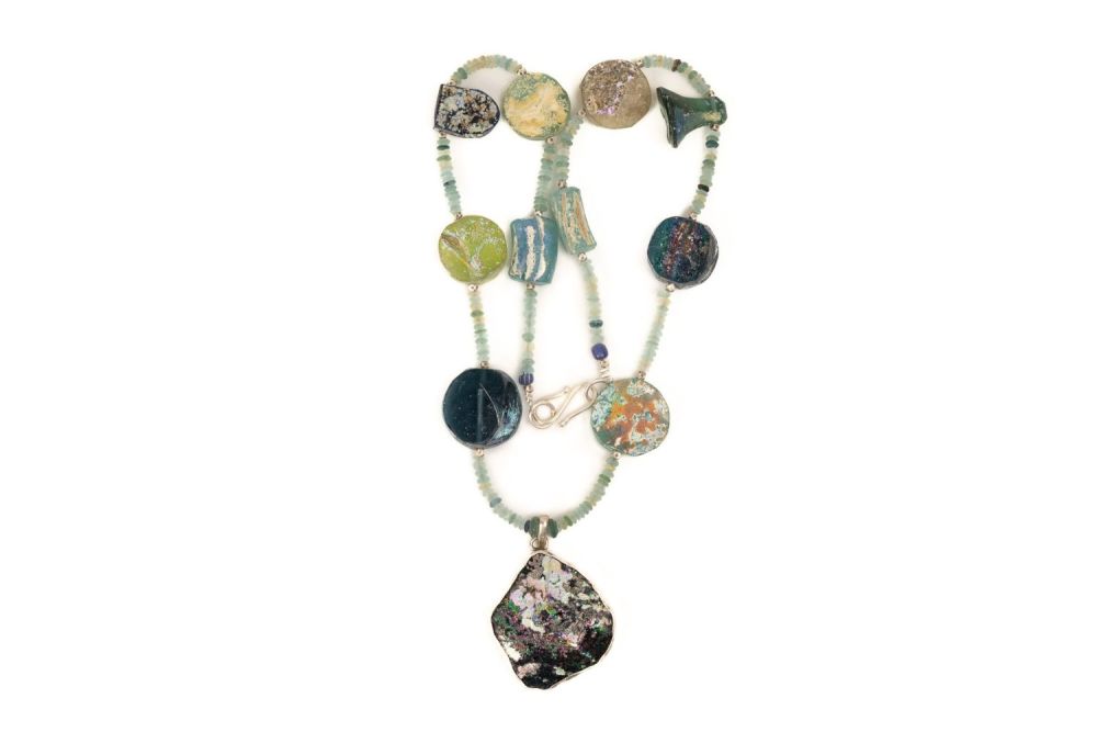 Lot 196: A Roman Glass Bead Necklace with a Circular...