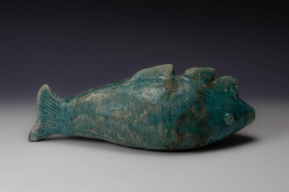 Lot 199: A Sassanid Green Ceramic Bottle in the Form...