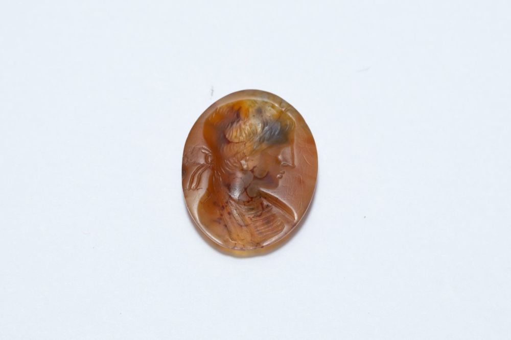 Lot 206: An Ancient Roman Red Circular Agate Stone Depicting...