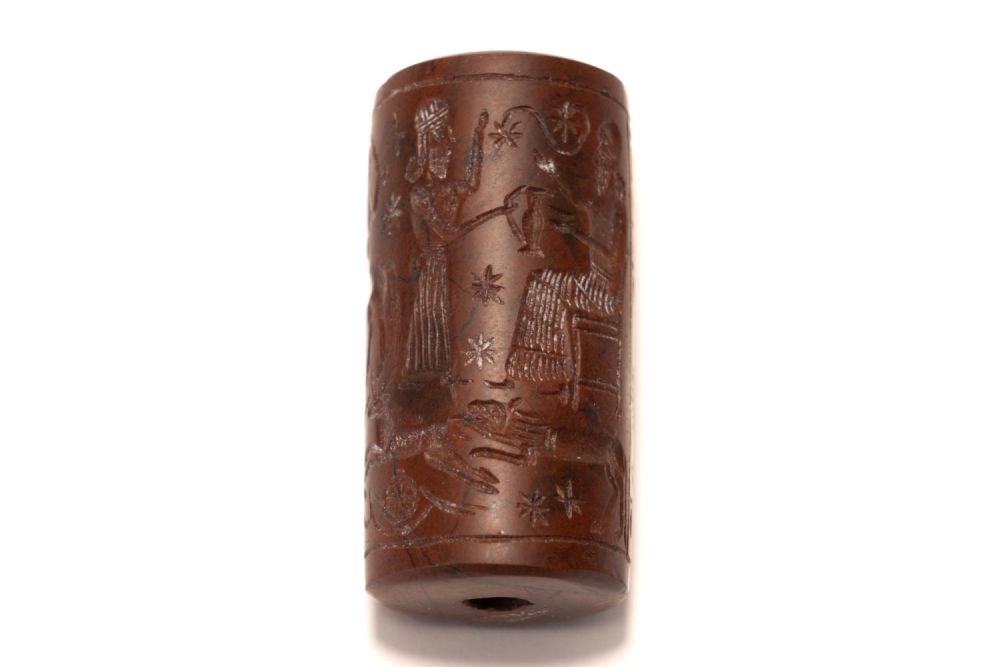Lot 226: A Red Jasper Cylindrical Seal Inscribed with Cuneiform...