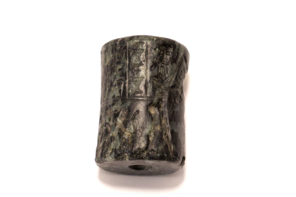 Lot 227: A Serpentine Cylindrical Stone in the Style of...
