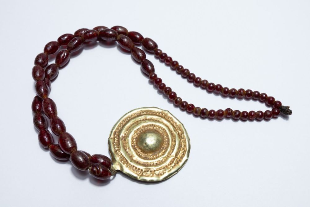 Lot 242: A Roman Gold Hoop Head Necklace with Red...