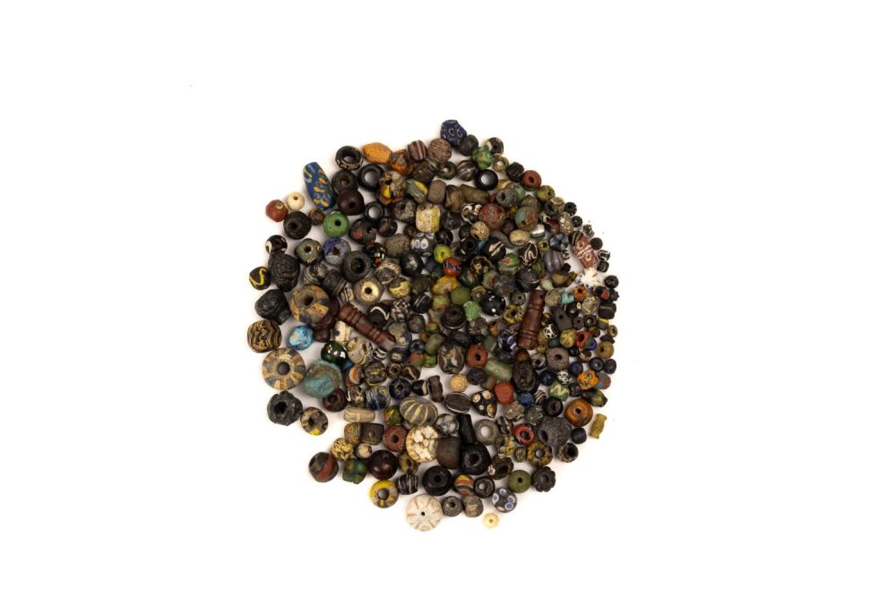 Lot 252: A Collection of Islamic and Roman Beads.