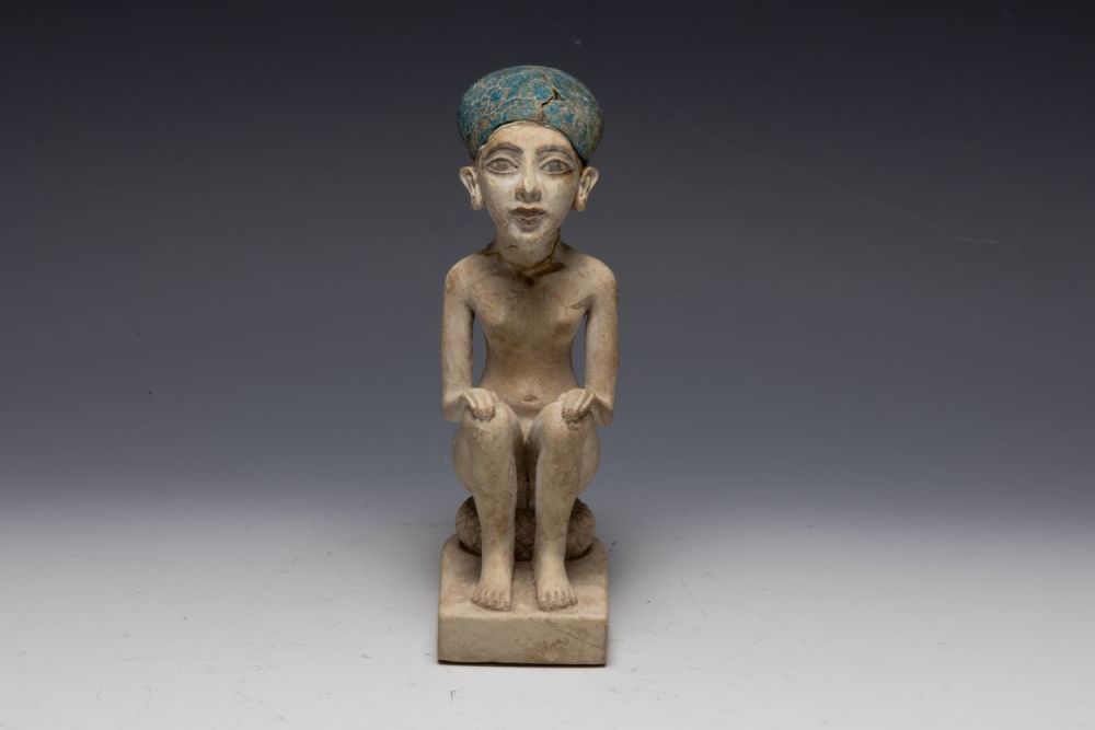 Lot 259: An Egyptian Style Figure of a Seated Man.