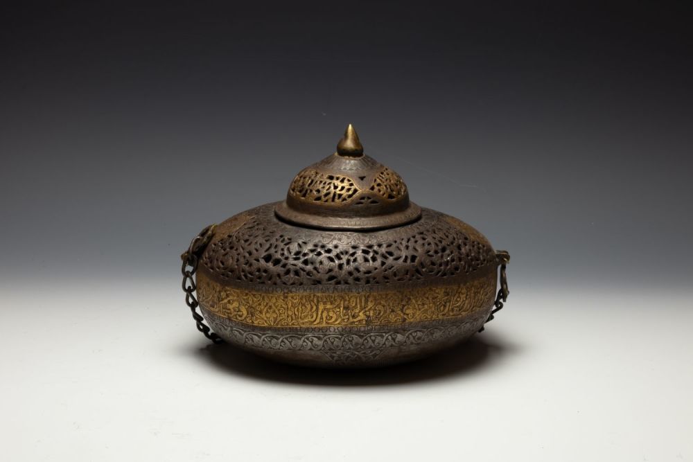 Lot 298: An Islamic Iron Kashkul + Lid with Gilt...
