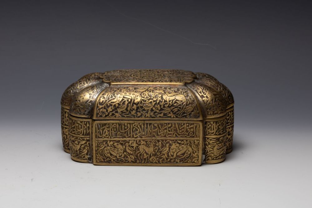 Lot 301: An Islamic Indian Brass Jewellery Box with Islamic...