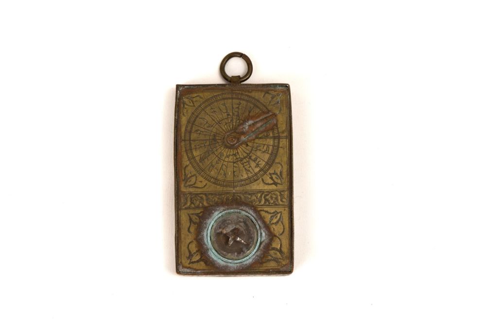 Lot 305: An Islamic Brass Pocket Compass.