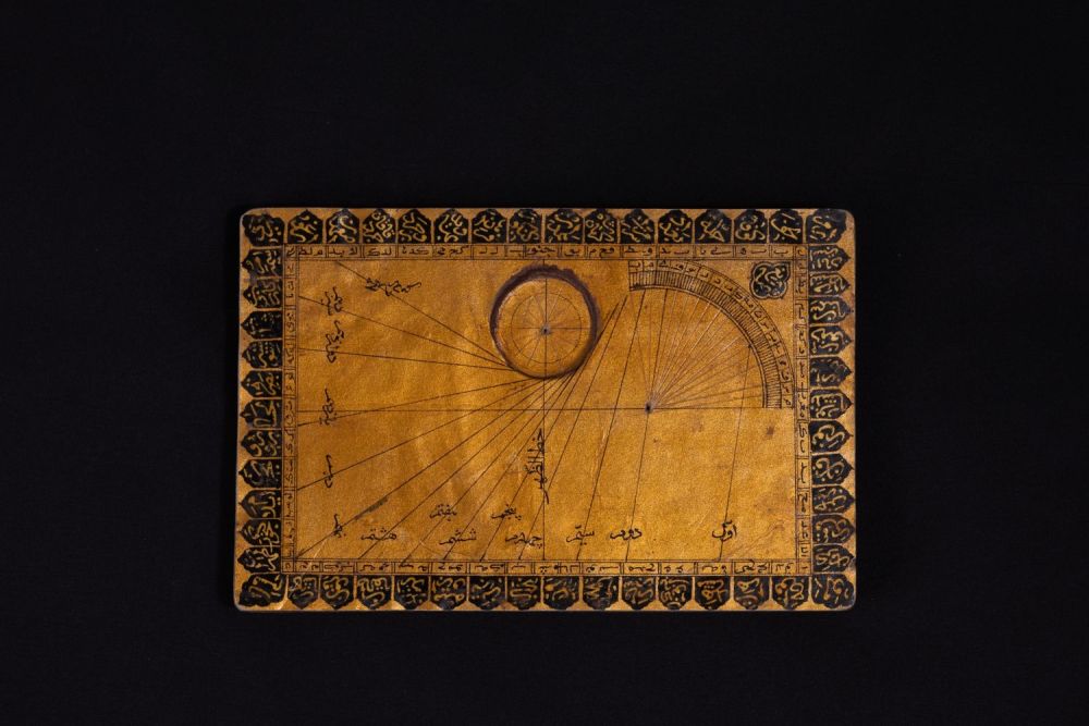 Lot 312: An Islamic Paper Mache Qibla Indicator and Sundial.