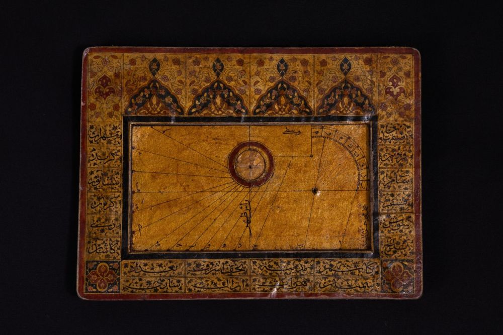Lot 313: An Islamic Paper Mache Qibla Indicator and Sundial.