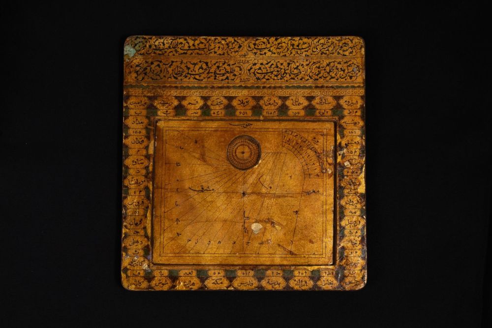 Lot 314: An Islamic Paper Mache Qibla Indicator and Sundial.