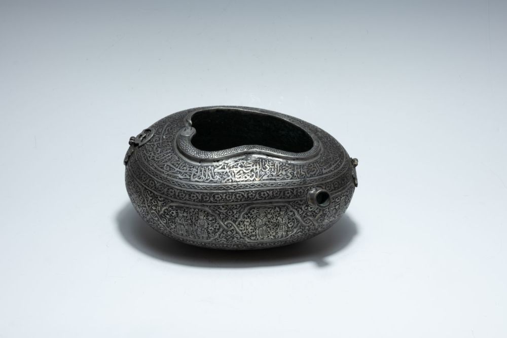 Lot 329: A Large Islamic Persian Copper Kashkul Depicting Islamic...