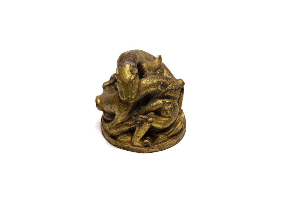 Lot 349: A Chinese Bronze Gilt Paperweight Depicting 2 Dragons.