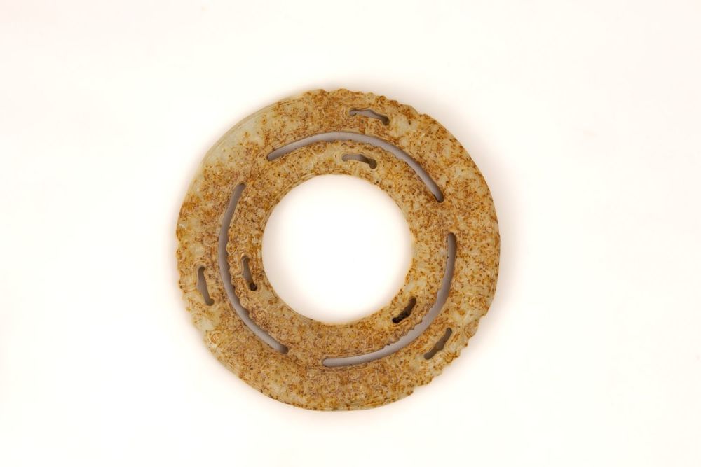 Lot 352: A Chinese Jade Circular Plaque Depicting 2 Dragons.