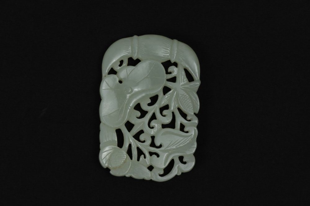 Lot 380: A Chinese Jade Pendant Depicting Floral Patterns