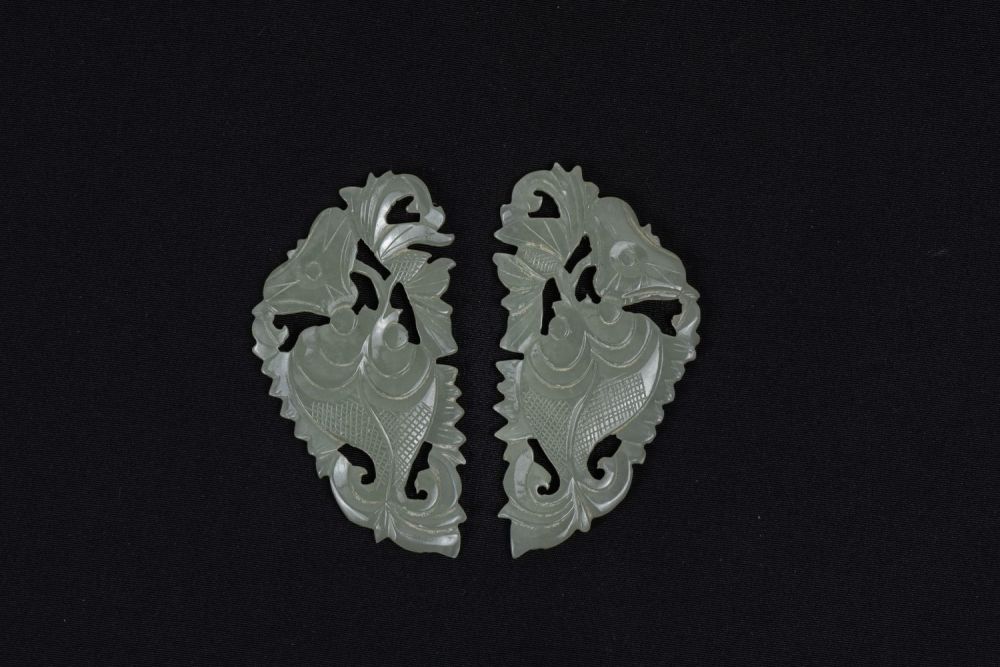 Lot 384: A Pair of Chinese Jade Accessories Used for...