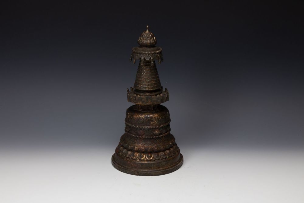 Lot 397: A Tibetan Bronze Gilted Buddhist Stupa.
