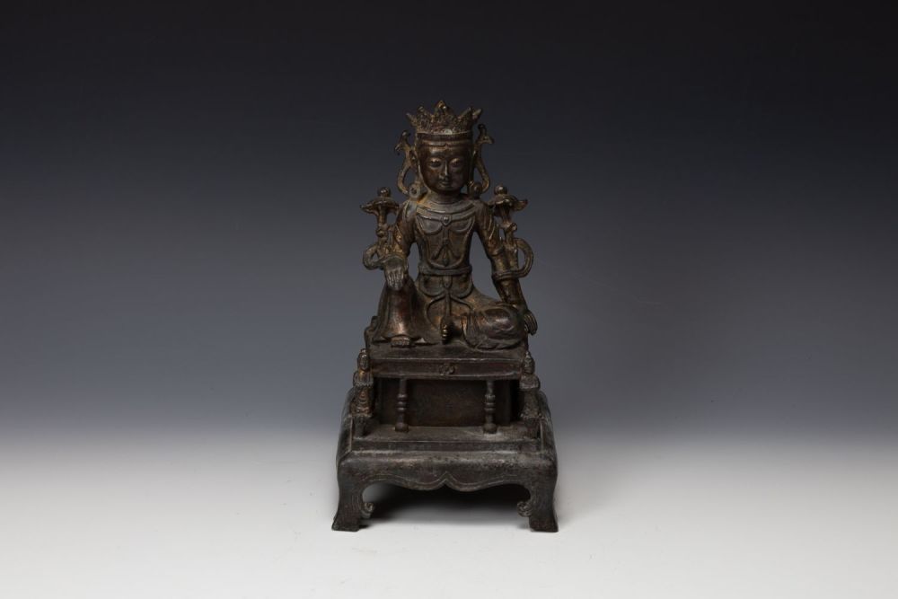 Lot 398: A Tibetan Bronze Gilted Buddhist Seated Figure of...
