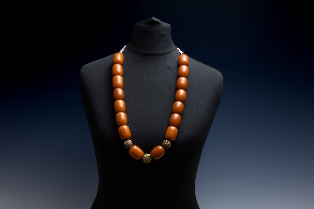 Lot 432: A Tribal Yemeni Amber Colour Beads with 3...