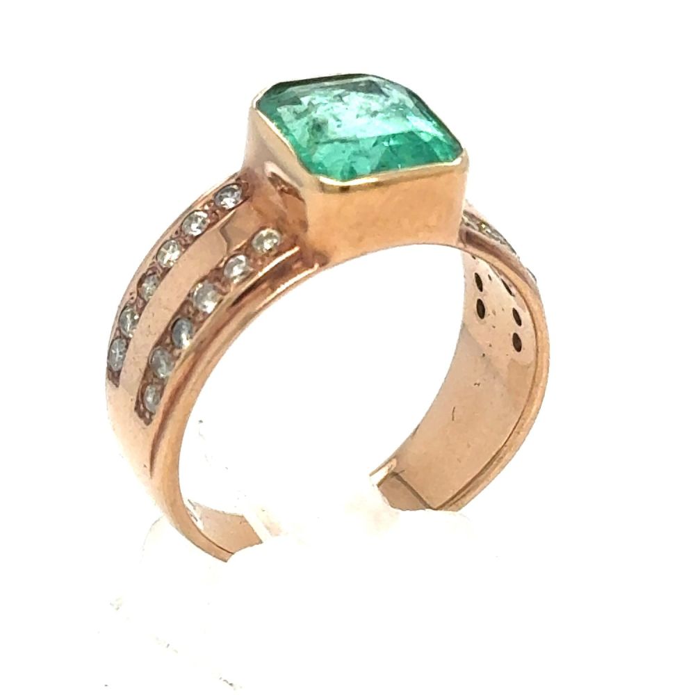 Lot 437: An Emerald and Diamond Ring in Rose Gold.