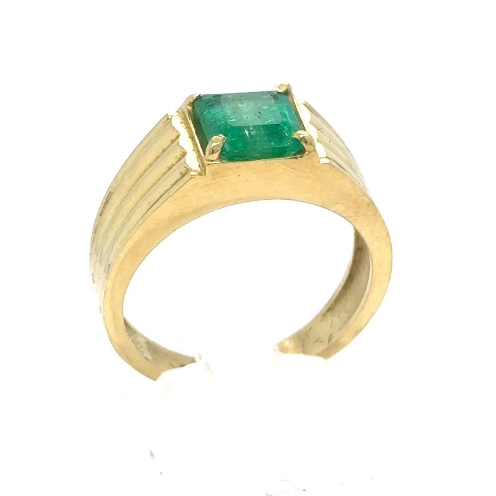 Lot 438: An Emerald and Diamond Ring in Yellow Gold.