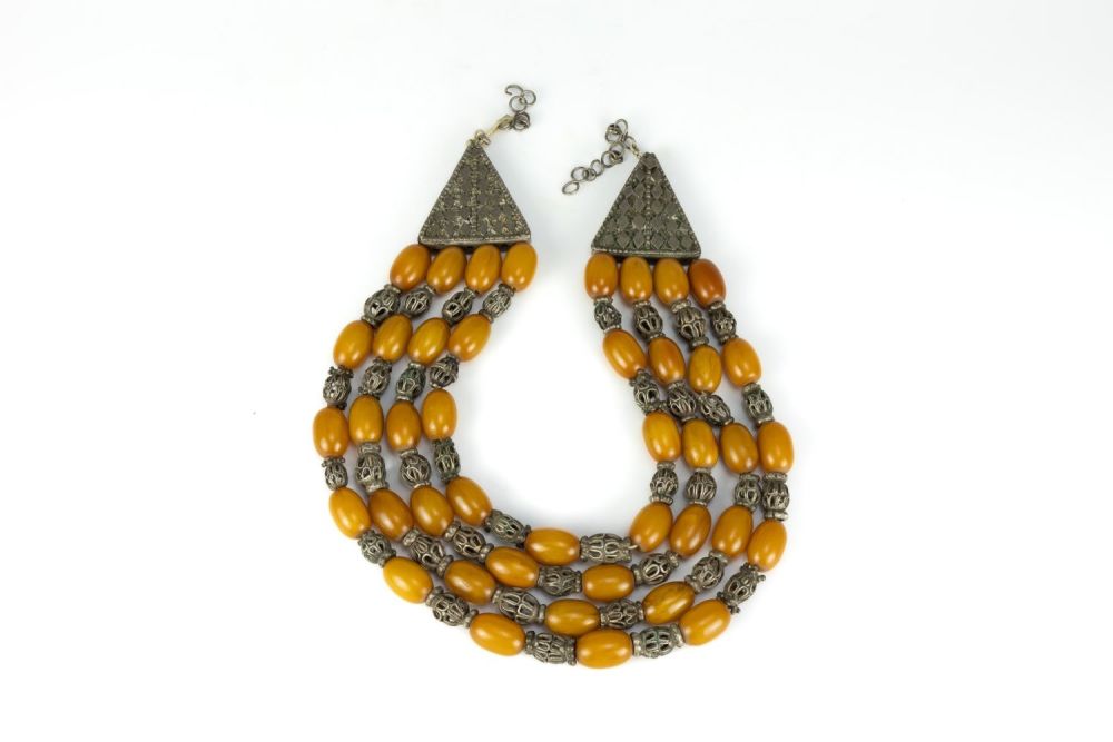 Lot 445: A Large Tribal Yemeni White Metal and Amber...