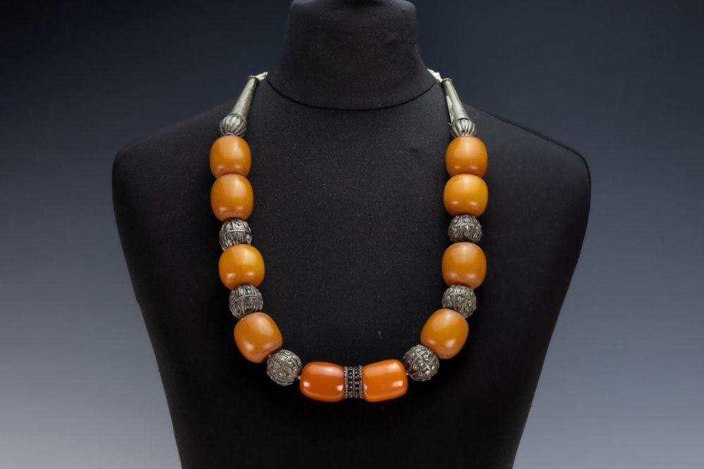 Lot 454: A Tribal Yemeni White Metal Necklace with Amber...