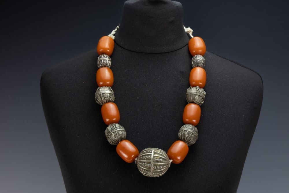Lot 458: A Tribal Yemeni White Metal and Amber Colour...