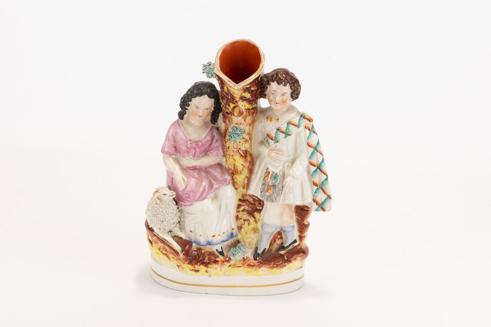 Lot 22: A Staffordshire Spill Vase of a Highland Group...