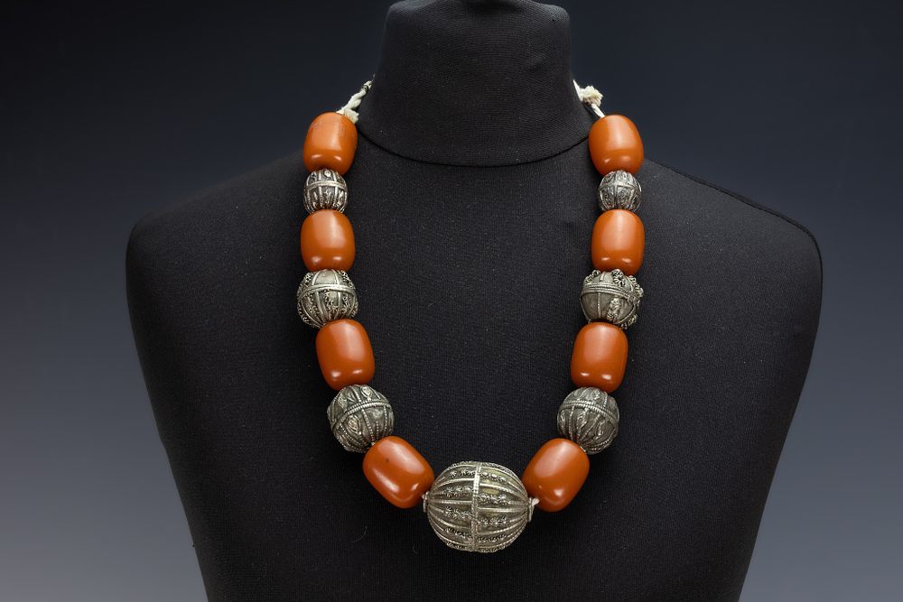 Lot 34: A Tribal Yemeni White Metal and Amber Colour...