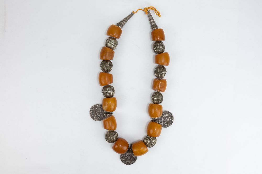 Lot 36: A Tribal Yemeni Amber and Silver Beads Necklace...