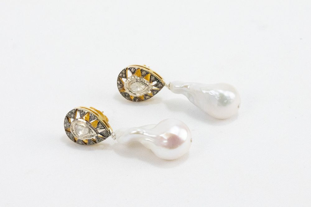 Lot 47: A Pair of Indian Silver Gilted Polki Diamond...