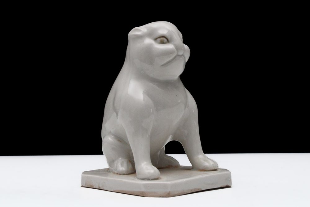 Lot 82: A Chinese White-Glazed Porcelain Figure of a Seated...