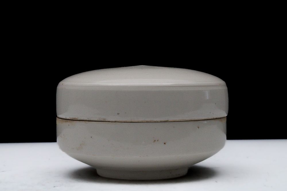 Lot 83: A Chinese White-Glazed Ceramic Round Pot with a...