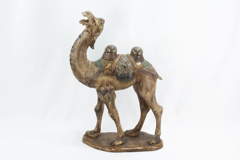 Lot 102: A Chinese Ceramic Figure of a Camel from...