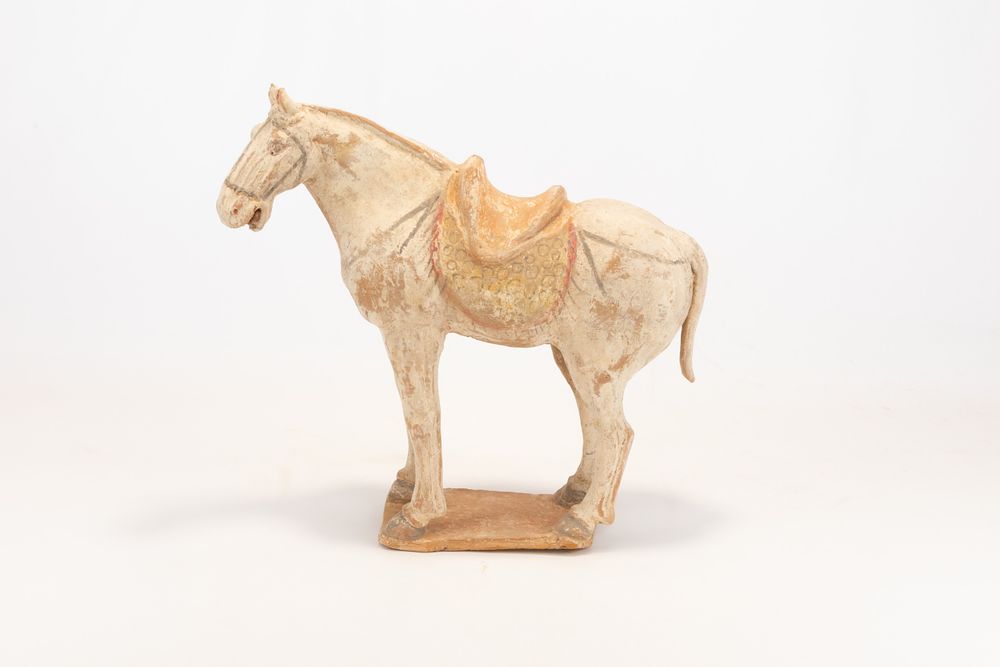 Lot 104: A Chinese Pottery Figure of a Horse with...