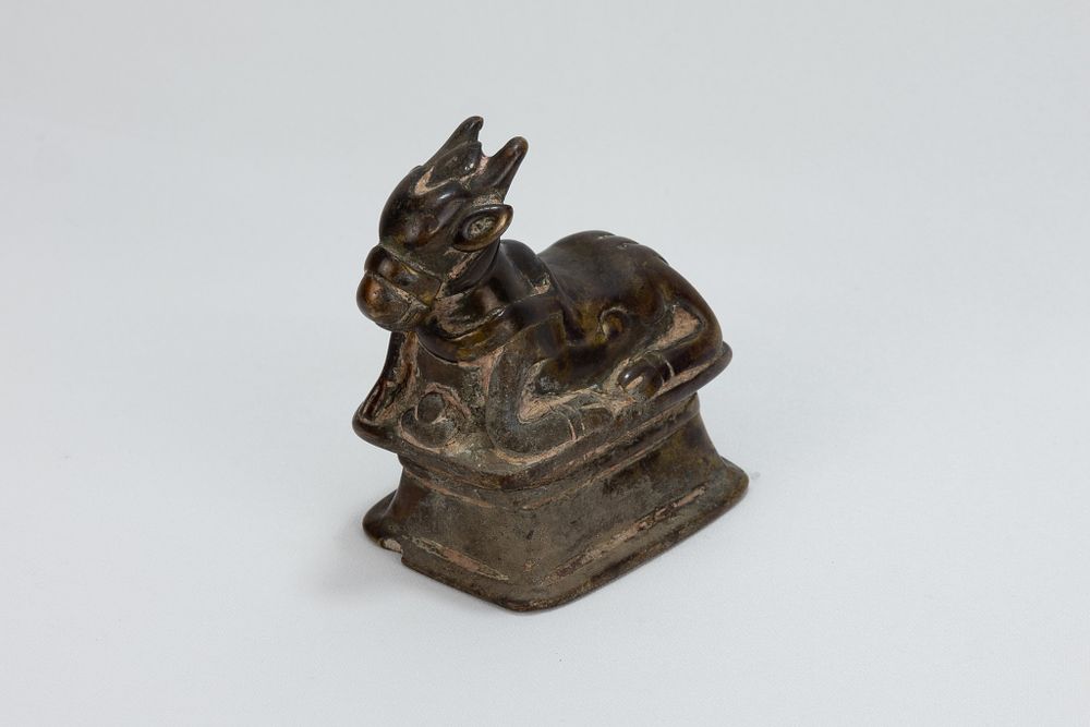 Lot 118: An Indian Copper Figure of Nandi Sacred Cow...