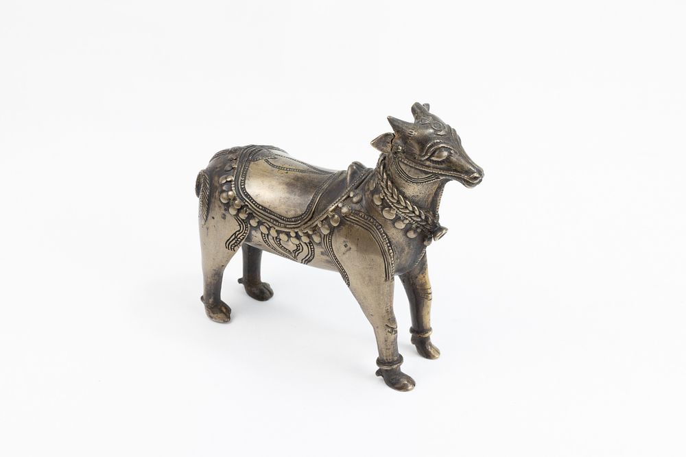 Lot 123: An Indian Mughal Bronze Figure of a Cow.