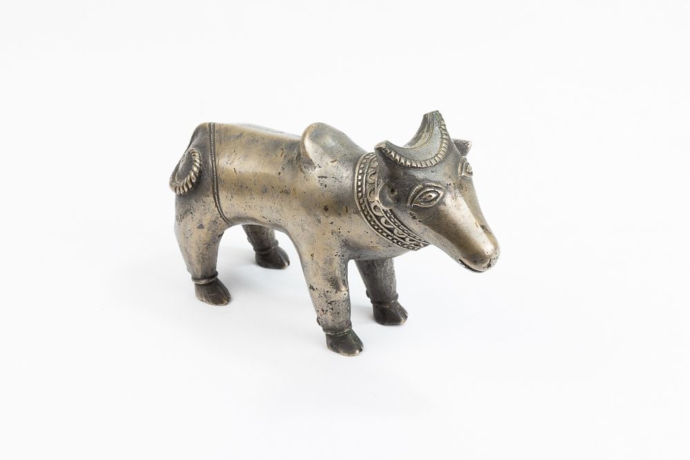Lot 124: An Indian Mughal Bronze Figure of a Cow.