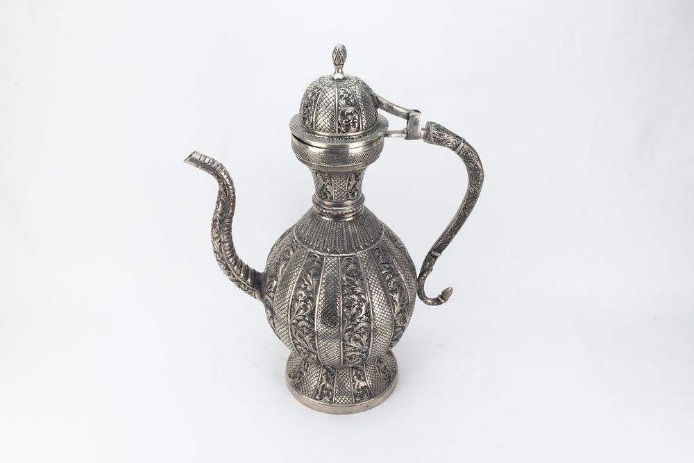 Lot 128: An Indian White Metal Ewer Decorated with Intricate...
