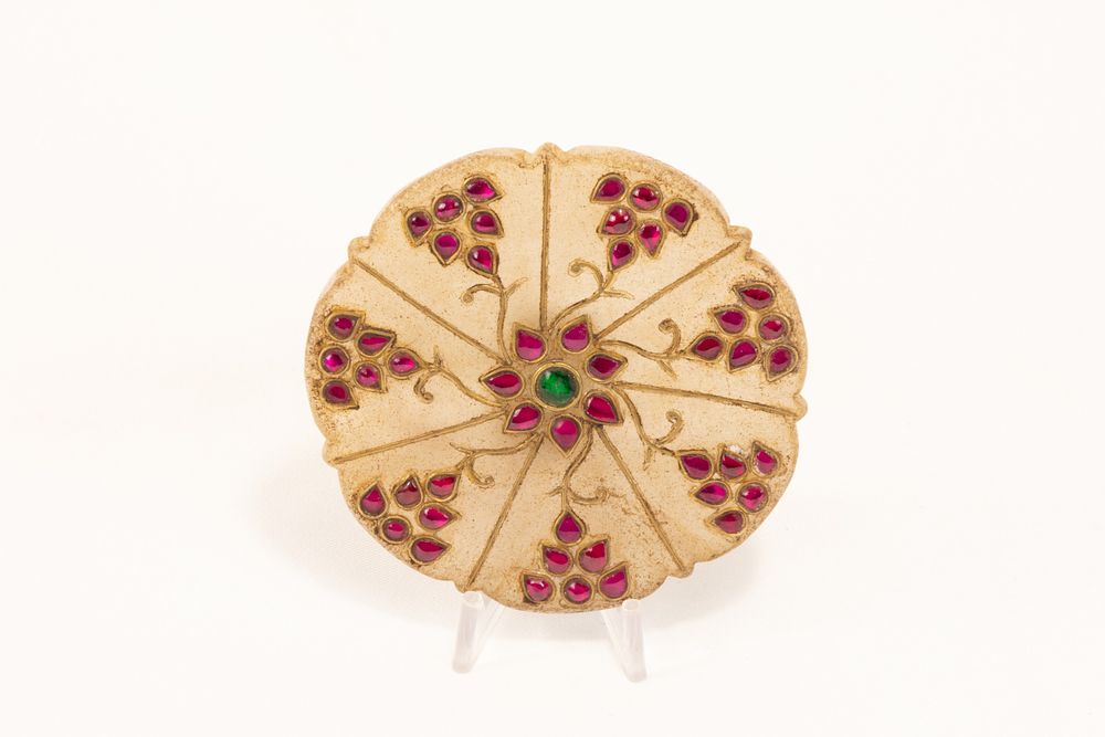 Lot 142: An Indian Mughal-Style Round Jade Pendant Decorated with...