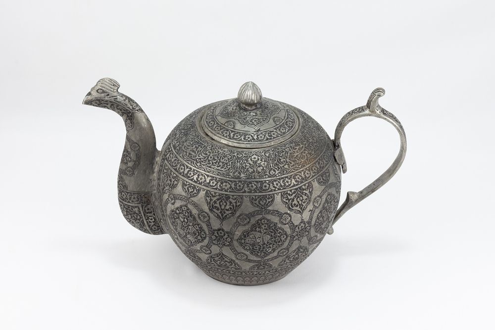 Lot 162: An Indo-Persian Copper Tea Pot with Intricate Carvings...
