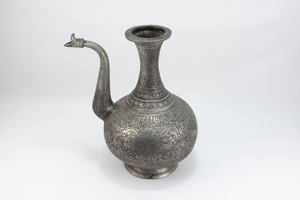 Lot 163: An Islamic Middle Eastern Copper Water Jug with...