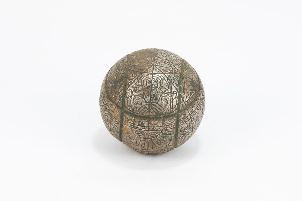 Lot 165: An Islamic Indo-Persian Iron Astrolabe with Intricate Carvings.