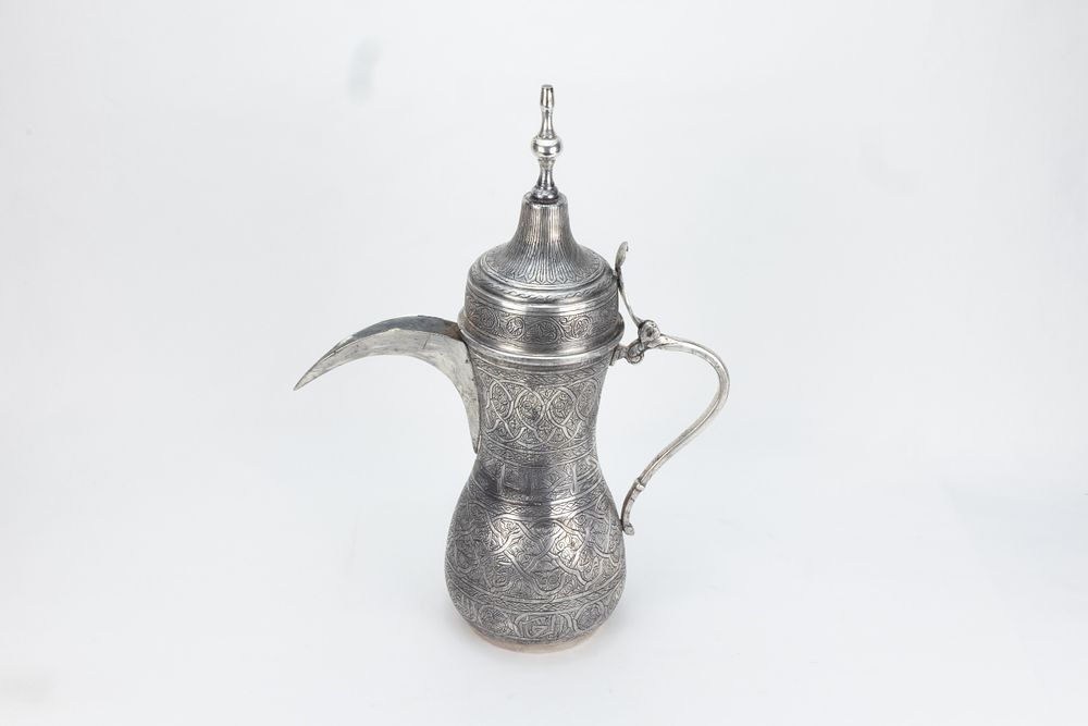 Lot 194: An Islamic Middle Eastern Silver-Tested Coffee Pot
