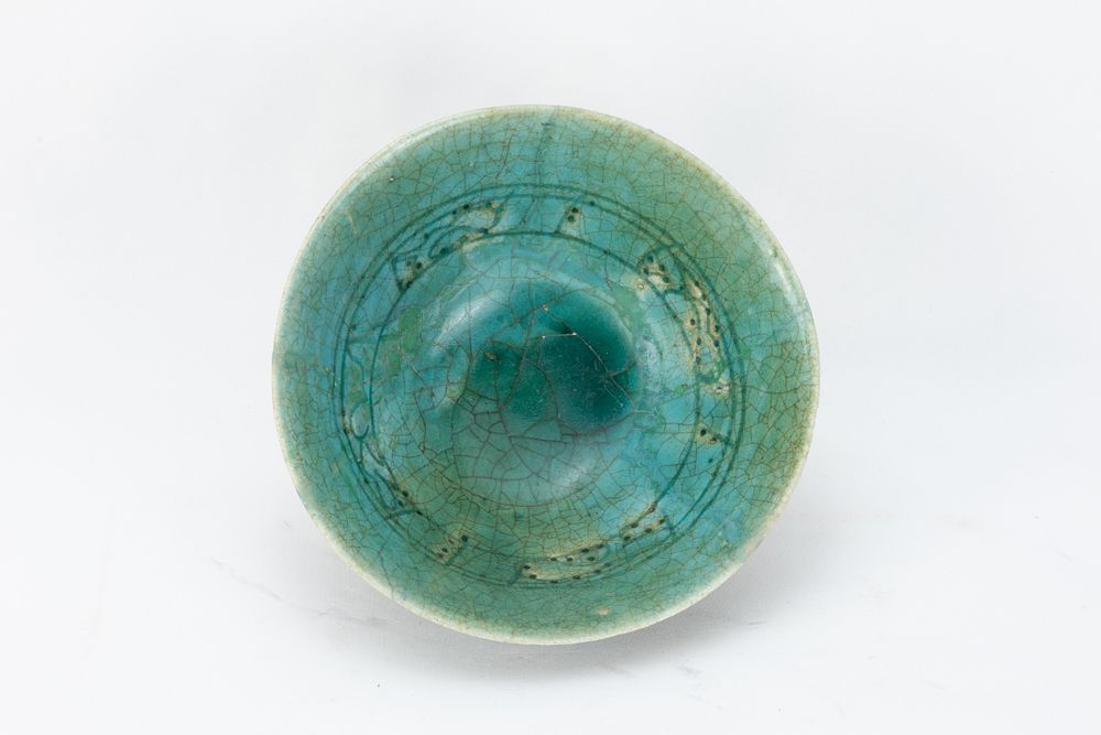 Lot 199: An Islamic Kashan Ceramic Green Glazed Bowl from...