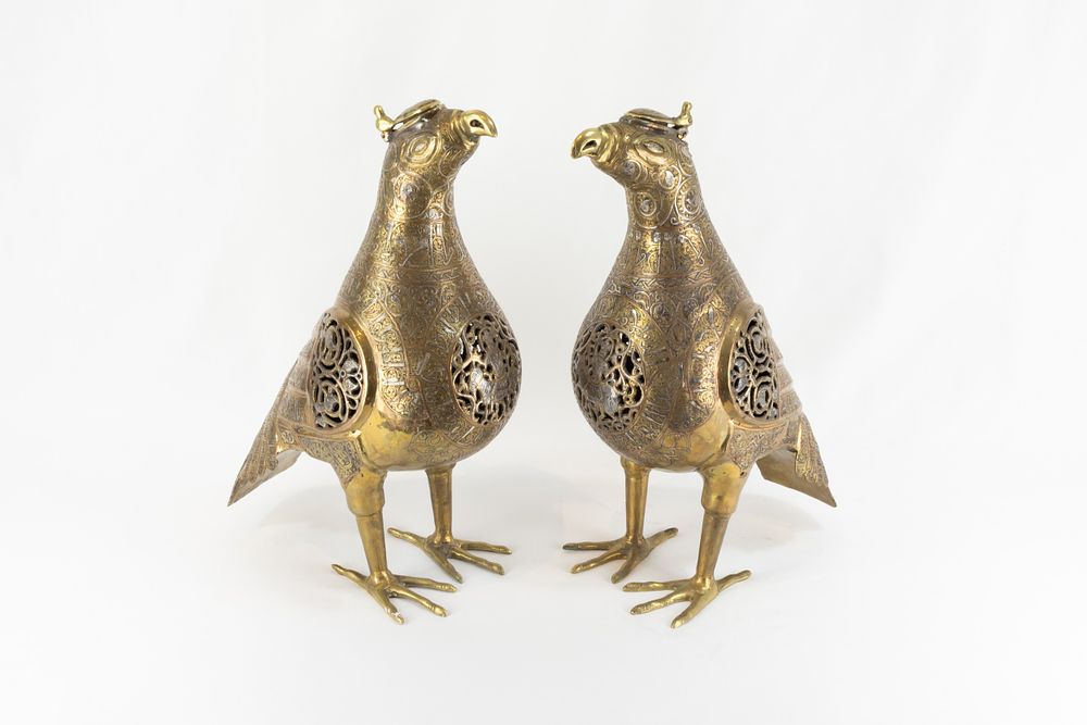 Lot 211: A Pair of Islamic Bronze Birds Decorated with...