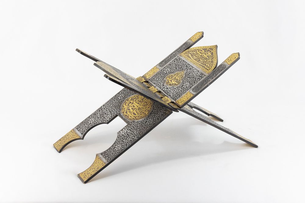 Lot 212: An Islamic Steel Qur'an Holder with Intricate Carvings...